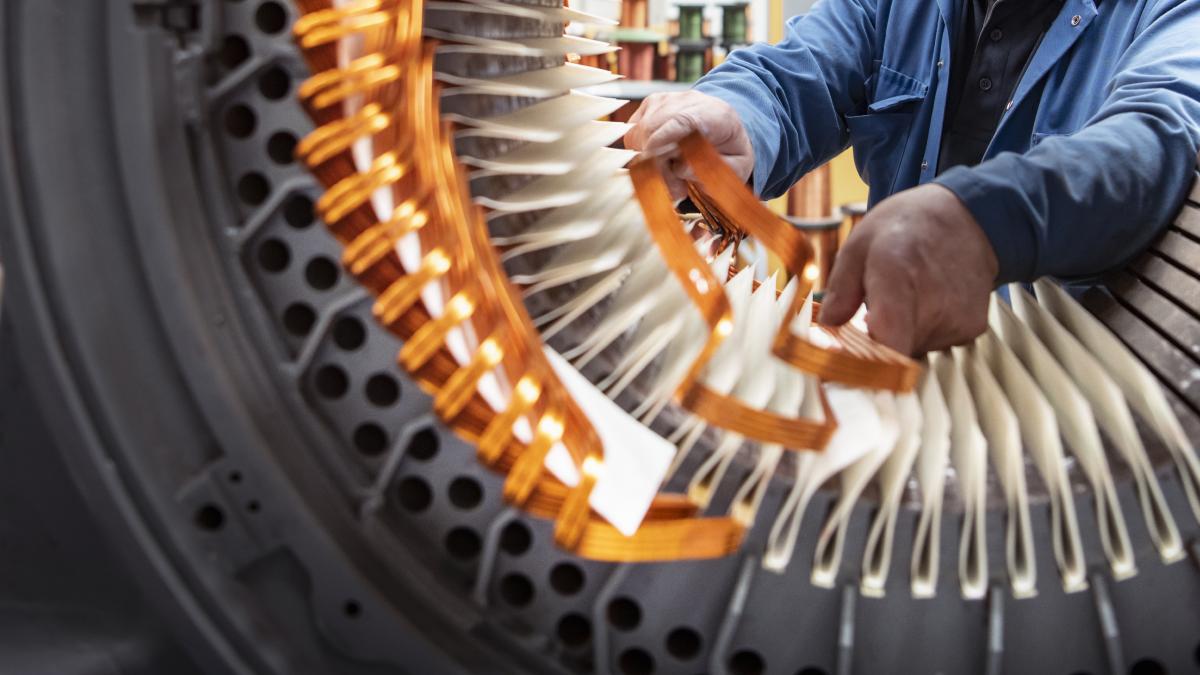 Electrical engineer working on generator stator