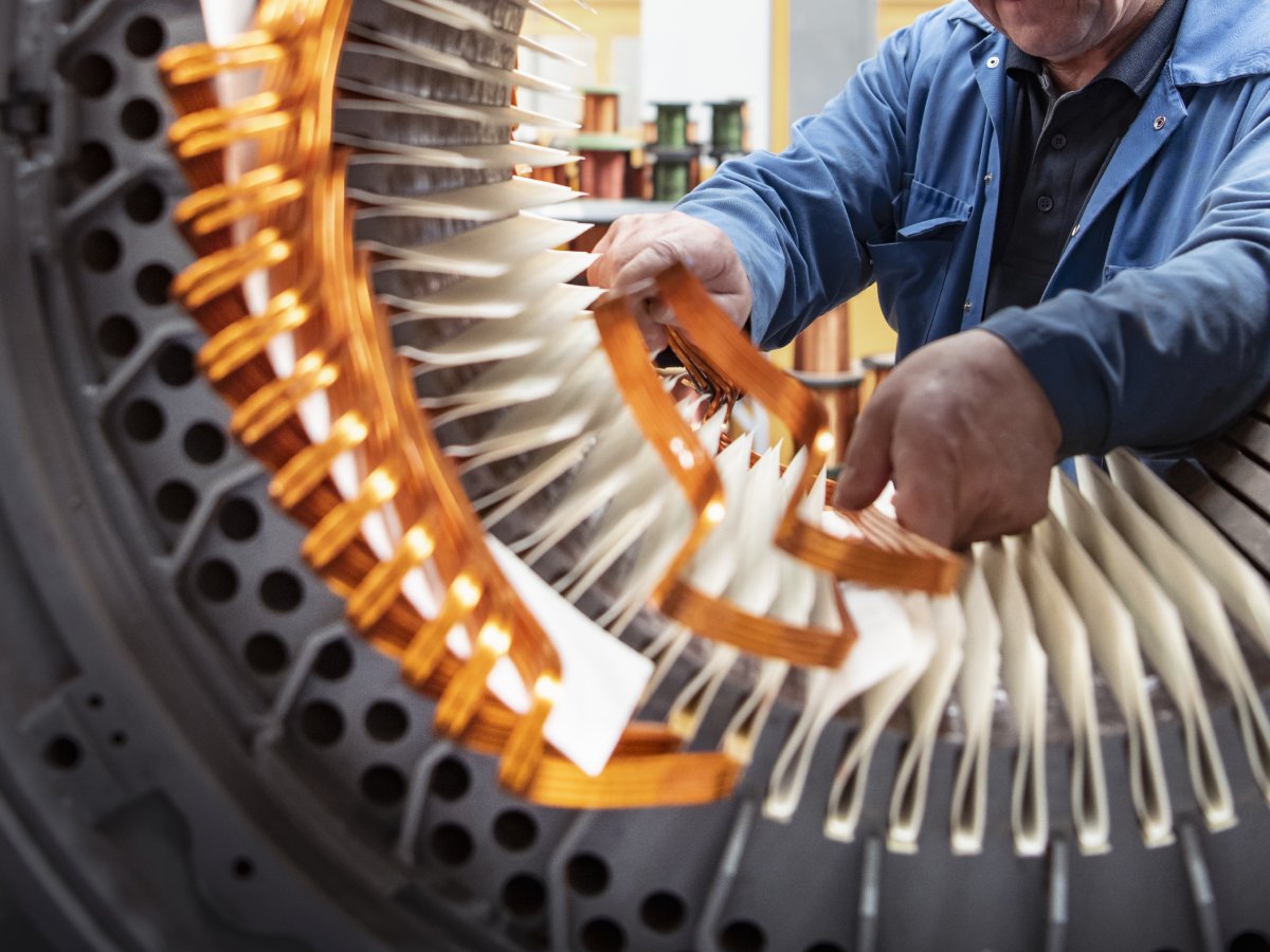 Electrical engineer working on generator stator