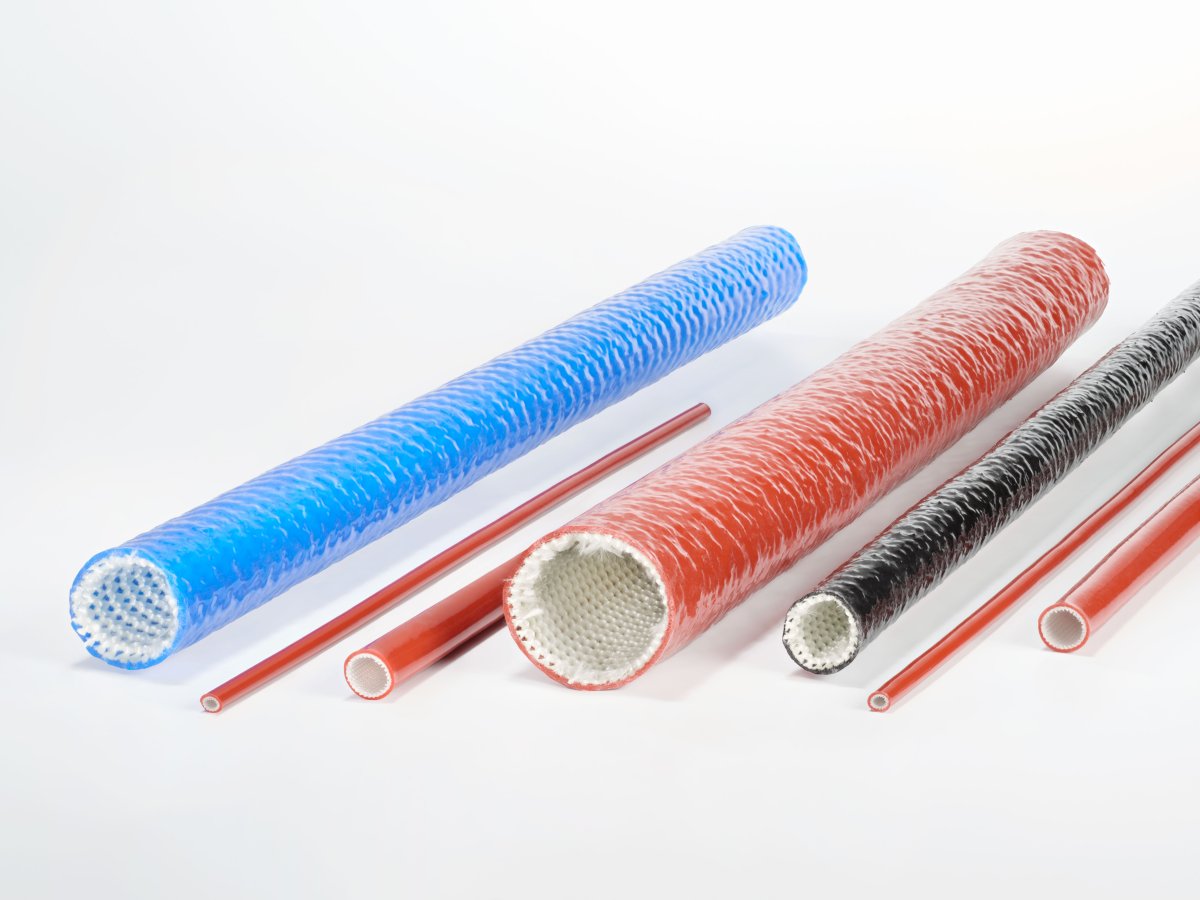 Several cylindrical tubes and rods of different colors are arranged side by side.
